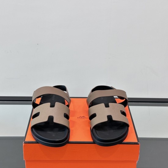 Hermes Genius Sandals in Etoupe Leather front angle display in black