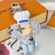 L Women's Vivienne Chef Bag Charm Detail View Close-up view of the L Women's Vivienne Chef Bag Charm And Key Holder Signature showing detailed chef hat and monogram petals
