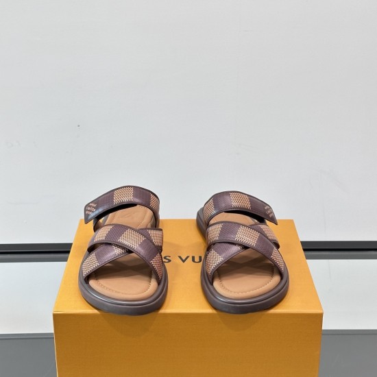 Front View Of Brown L Flat Mules Front facing view of the brown L Venice flat mules showcasing the cross straps