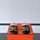 Hermes Chypre Suede Sandals Front View in pink and olive Front view of the Hermes Chypre suede sandals displaying the H-strap design in pink and olive