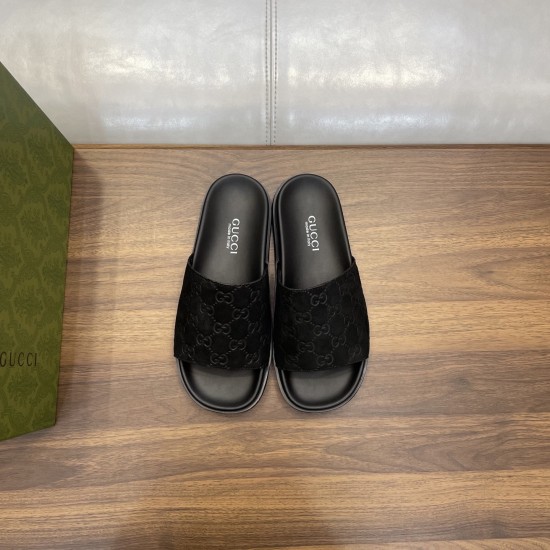 Gucci Black Gg Suede Slide Sandals Pair Top View Top-down view of black Gucci slide sandals displaying branded footbeds