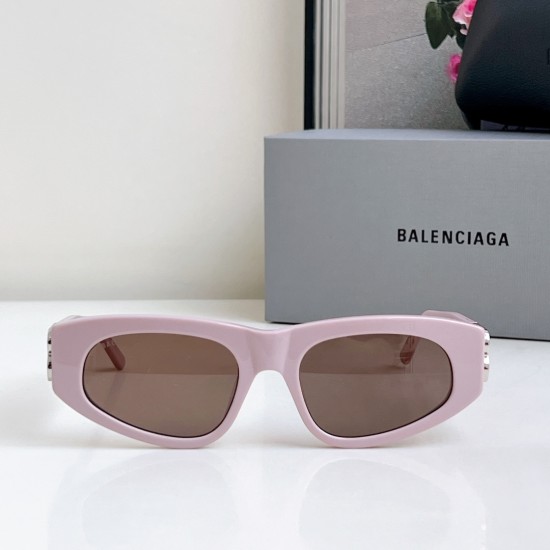 Women's Front View Pink Narrow Sunglasses Women's Frontal view of light pink oval narrow sunglasses displaying frame shape and dark lenses