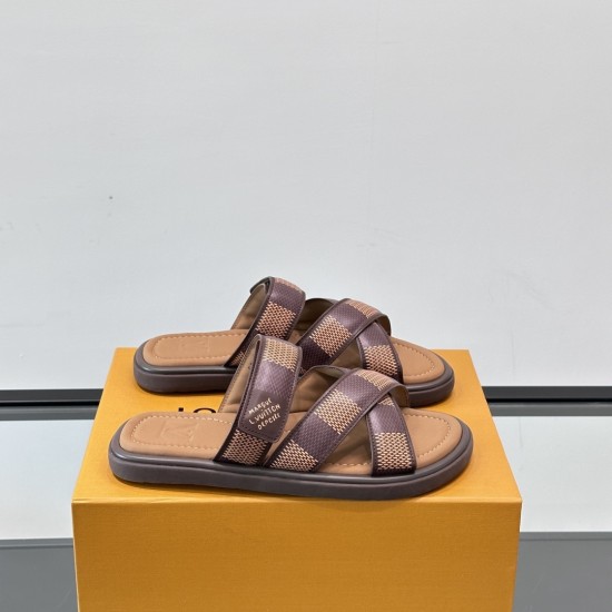Angle View Of Brown L Flat Mules On Box Angle view of the brown L Venice flat mules resting on an orange box