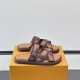Angle View Of Brown L Flat Mules On Box Angle view of the brown L Venice flat mules resting on an orange box