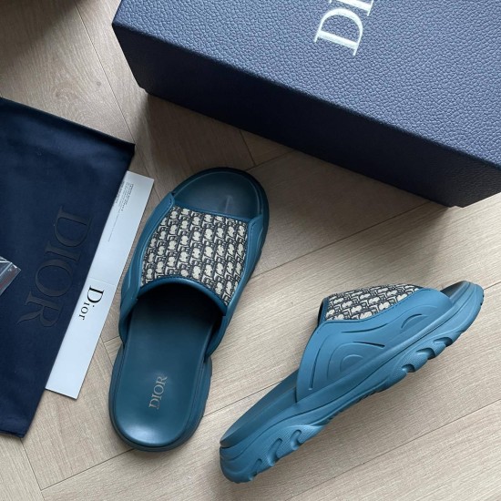 Dior Blue Sandals Box Presentation Angled layout of the blue sandals next to the matching branded storage box and dust bag