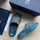 Dior Blue Sandals Box Presentation Angled layout of the blue sandals next to the matching branded storage box and dust bag