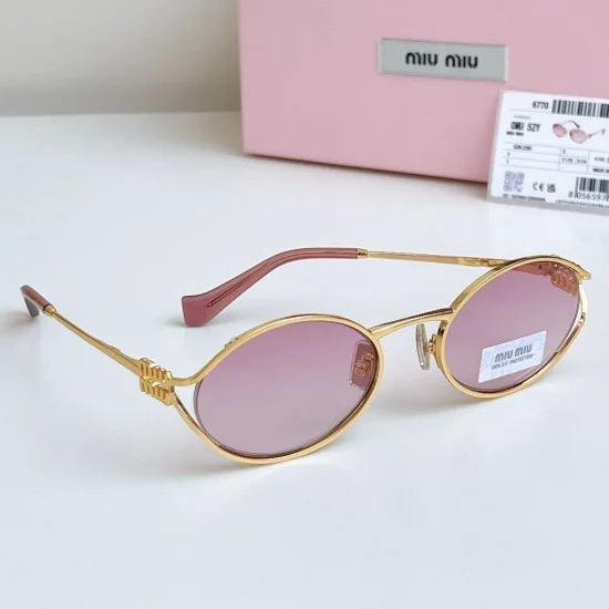Miu Miu Women's Oval Frame Pink Gold Sunglasses Side Profile Miu Miu Women's Oval Frame Pink Gold Sunglasses three-quarter side view