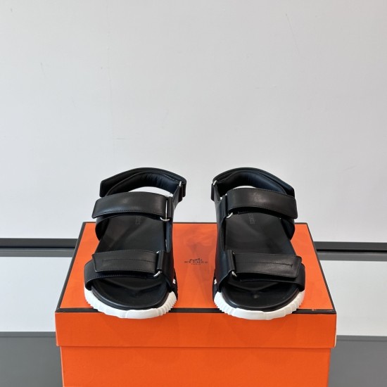 Hermes black leather junior sandals front view highlighting double straps in black and white