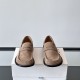 Loewe Men's Suede Penny Loafers In Tan Brown Front View Front view of Loewe Men's Suede Penny Loafers In Tan Brown showing toe box and penny strap details