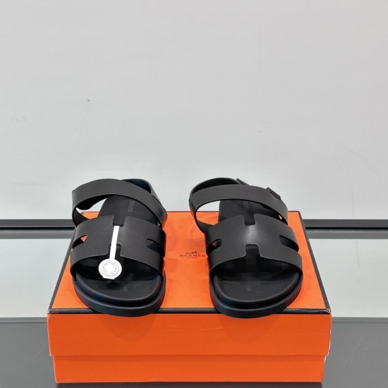 Hermes Black Leather Sandals Front View Front angle view of the pair of black leather sandals displaying the toe area and cutout pattern