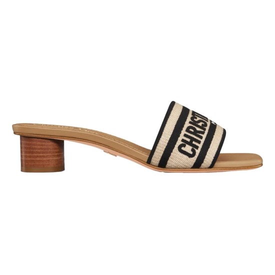 Side profile of Dior natural raffia block heel slide in black Side profile view of Dior natural raffia slide showing black embroidery and wooden block heel