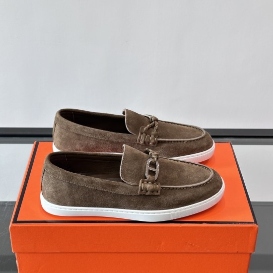 Hermès Men's Ignacio Suede Loafers in Étoupe Brown - Side View Hermès Men's Ignacio Suede Loafers in Étoupe Brown side profile on orange presentation box