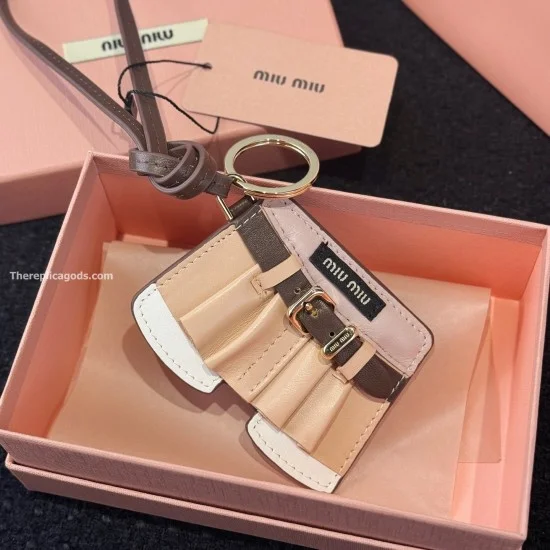 Detailed close-up view of the Miu Miu Women's Leather Jacket Trick Keychain Bag Charm showing buckle and stitching
