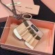 Detailed close-up view of the Miu Miu Women's Leather Jacket Trick Keychain Bag Charm showing buckle and stitching