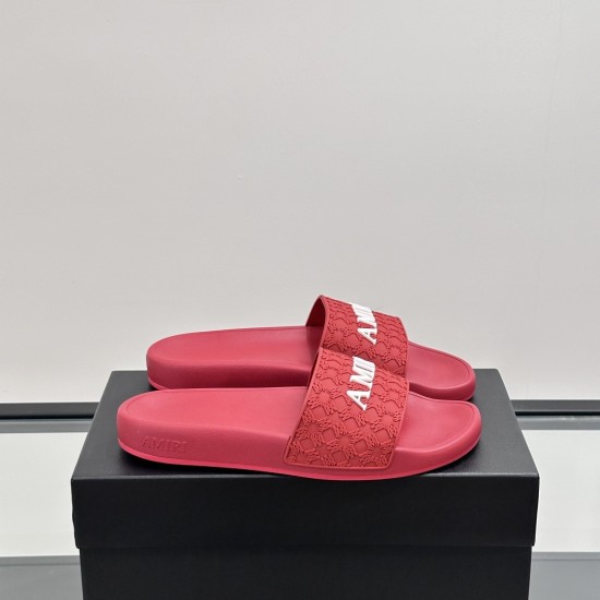 Angled pair view of the bright red slides resting on a black box with white branding