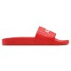 Side profile view of the bright red Amiri slide showcasing the textured strap and midsole branding
