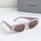 Women's Pink Sunglasses with Branded Box Women's Front side angle of pink narrow sunglasses resting on a surface next to a grey branded box