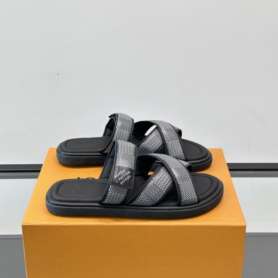 Angled View of Black L Venice Mules on Box Angled view of black L Venice Mules resting on an orange box