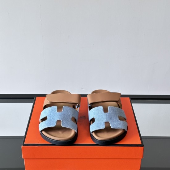 Hermes Chypre Sandals In Blue And Brown Front View Hermes Chypre Sandals In Blue And Brown front view highlighting the H-cutout toe straps
