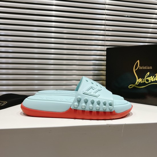 Christian Louboutin Blue and Red Mules with Box Packaging Christian Louboutin blue and red mules positioned beside a branded black box