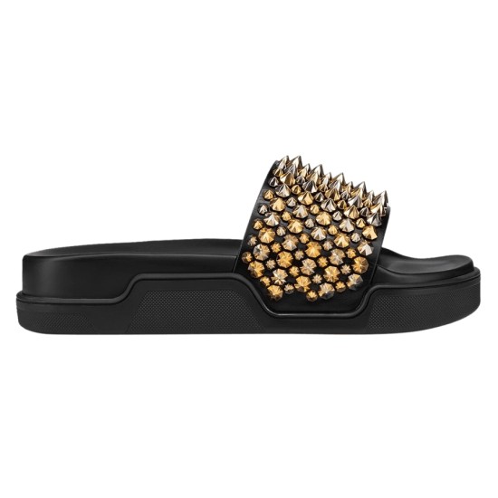 Christian Louboutin Pool Roc black gold spiked slide side profile Side profile view of the black slide featuring gold and silver spikes and a thick textured sole
