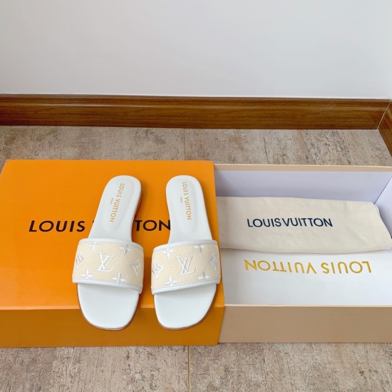 L Revival Flat Mules in white - Top View with Box Top-down view of L Revival Flat Mules in white presented alongside branded packaging