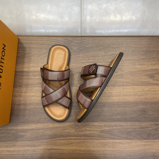 L Venice Mules Brown Angle View Angled top-down view of the brown L Venice Mules next to a branded orange box