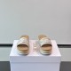 Dior Dway Platform Slides In White And Brown - Frontal View Frontal view of white and brown platform slides displaying the embroidered brand lettering