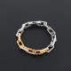 L Men's Monogram Chain Bracelet in Gold and Silver dark background L Men's Monogram Chain Bracelet in Gold and Silver laid flat on dark background