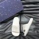 Gucci White Rubber Slide Sandals with Presentation Box Top angle view of Gucci white rubber slide sandals next to a dark blue presentation box