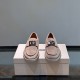 Dolce & Gabbana Men's Brown Suede Hardware Plaque Loafers front view showing metallic plaque detail
