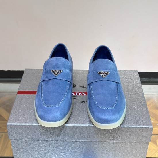 Front view of Prada Men's Blue Suede Loafers Soft Slip On Shoes displaying metal triangle logo