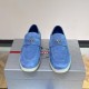 Front view of Prada Men's Blue Suede Loafers Soft Slip On Shoes displaying metal triangle logo