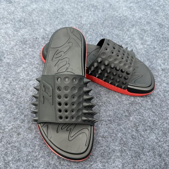 Christian Louboutin Take It Easy Black Slides Angled Pair in black and red Christian Louboutin Take It Easy Black Slides angled view with spiked strap in black and red