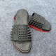 Christian Louboutin Take It Easy Black Slides Angled Pair in black and red Christian Louboutin Take It Easy Black Slides angled view with spiked strap in black and red