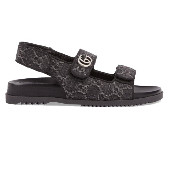 Side profile view of Gucci black and grey denim double strap sandals showing ridged sole and hardware