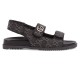 Side profile view of Gucci black and grey denim double strap sandals showing ridged sole and hardware