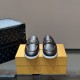 Front toe view of L Men's Estate Open Back Leather Loafers in black showing silver hardware in black and white