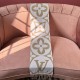 Front side of L Women's Medallion Brown Scarf draped vertically over a pink armchair in brown and white