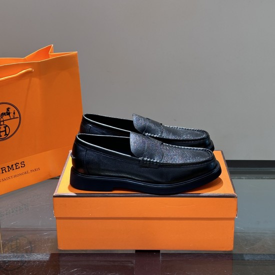 Hermes Men's Guillaume Black Loafers Angle View Three-quarter side angle of Hermes Men's Guillaume Textured Leather Loafers In Black displayed on box