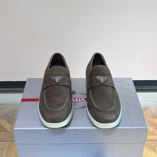 Prada Men's Grey Suede Penny Loafers Front View Front head-on view of Prada Men's Grey Suede Penny Loafers displaying triangular logos