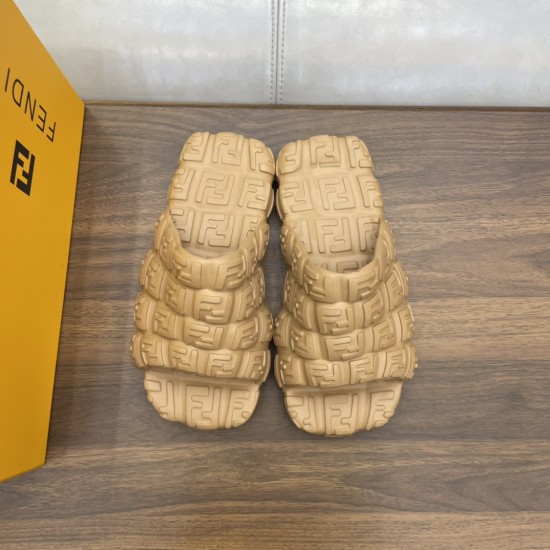 Fendi beige cloud slides front angle Fendi beige cloud slides front angle view beside yellow branded box
