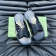 Gucci Black Leather Sandals Flat Top View Gucci black leather sandals arranged flat on a dark textured surface above a green box