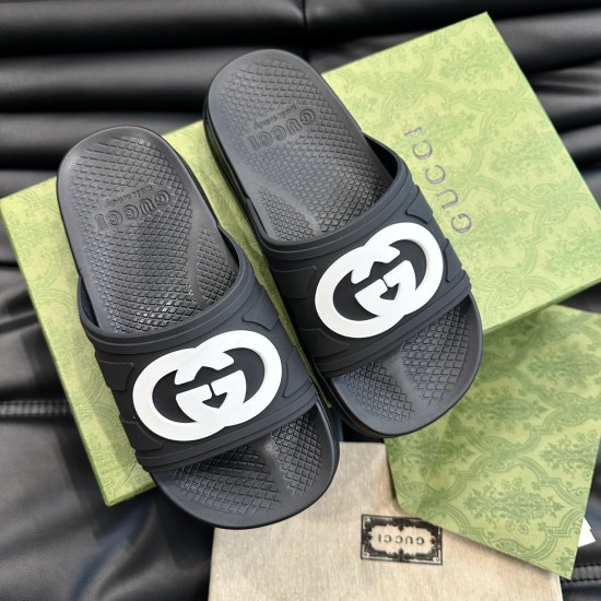 Gucci Men's Interlocking G Slide Sandals In Black Top View in black and white Gucci Men's Interlocking G Slide Sandals In Black top-down view showing textured black footbeds and white logos