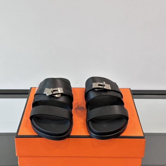 Hermes black leather sandals front view Front overhead view of Hermes black leather sandals highlighting metal hardware details
