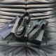 Angled view of black Prada Men's Diapason Opaque Brushed Leather Lace-Up Shoes resting on a branded box