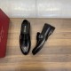 Ferragamo Men's Gancini Plaque Leather Loafers Black top-down view displaying insoles and side buckle detailing
