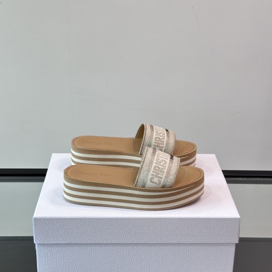Dior Dway Platform Slides In White And Brown - Angled Pair View Angled pair view of white and brown platform slides resting on a white presentation box