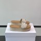 Dior Dway Platform Slides In White And Brown - Angled Pair View Angled pair view of white and brown platform slides resting on a white presentation box