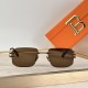 Front view of Balmain Men's men sunglasses in brown resting on a display tray
